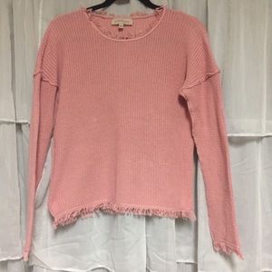 Light pink sweater with fringe detail